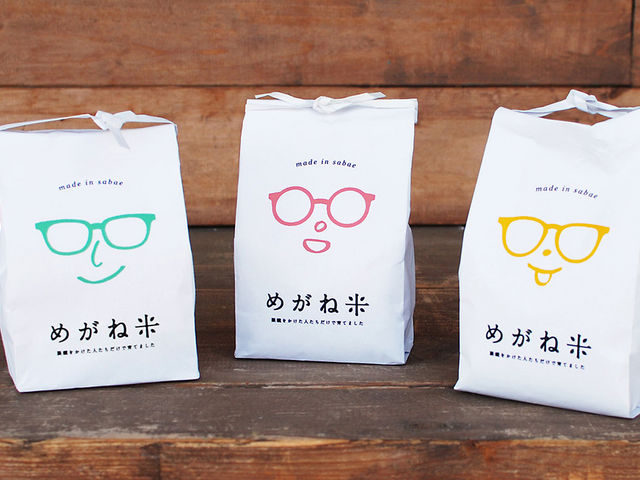 めがねの町「鯖江」でめがねをかけた農家様が作ったお米を、めがねをかけた福井精米の社員が精米し、めがねをかけた方が販促している『めがね米』_福井精米株式会社