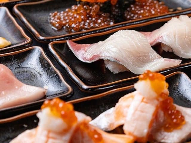 元祖ぶっち切り寿司 魚心 心斎橋店の写真1