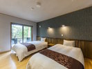 【別邸さくら/和洋室一例】ベッドルーム。シモンズ社製のベッドで快適な睡眠をお約束。
