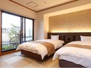 岩風呂付特別室:ベッド・岩風呂が室内についた和洋室です