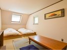 寝室B(1F) 小上がり+マットレス+布団が2床あります。