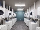 【ランドリールーム】1Fロビー階┃洗濯機・乾燥機各10台。24時間ご利用可。洗剤販売機・両替機もございます