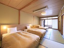 【特別和室ツインベッド】4名様までご利用いただける広々とした客室となっております(一例)