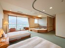 ・【バリアフリールーム】広めの洋室にシングルベッド2台を設置しております