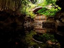 姉妹館:よろづやの庭園露天風呂より桃山風呂を望む