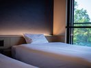 【客室イメージ】自然に包まれた、心地よい眠りのひととき。