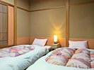 露天風呂付き客室の和風ベッド