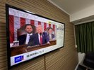 ��^TV