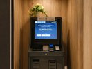 両替もできる自動精算機設置