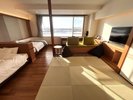 【シンクロツイン】十勝川の四季の風景をお楽しみいただけるシンクロツインルームは頭合わせのベッド配置