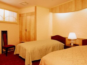 露天風呂付客室「石楠花の間」ツインベッドルーム広々した寝室でごゆっくりお休みいただけます